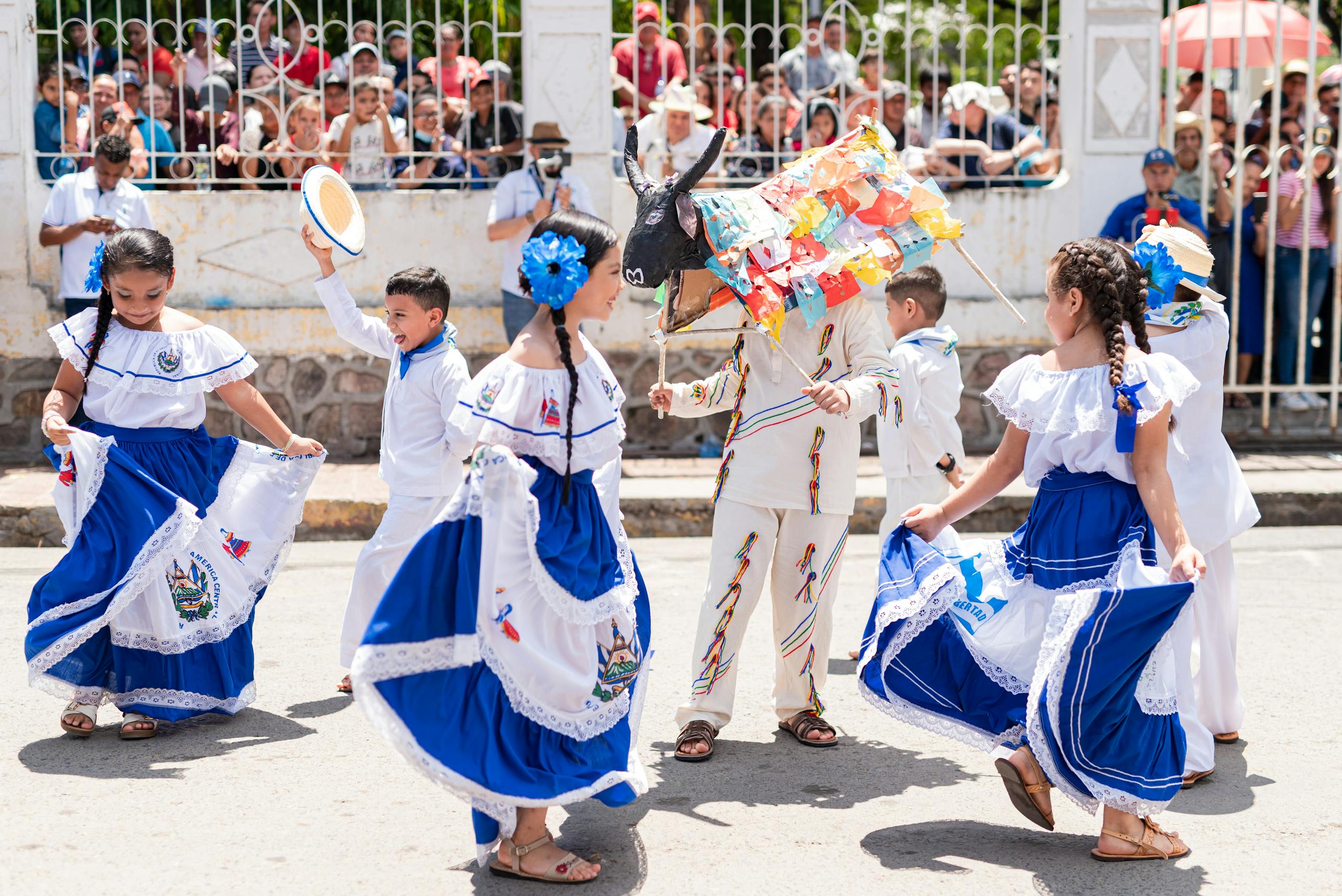 Girls Dancing in Traditional Clothing on Street